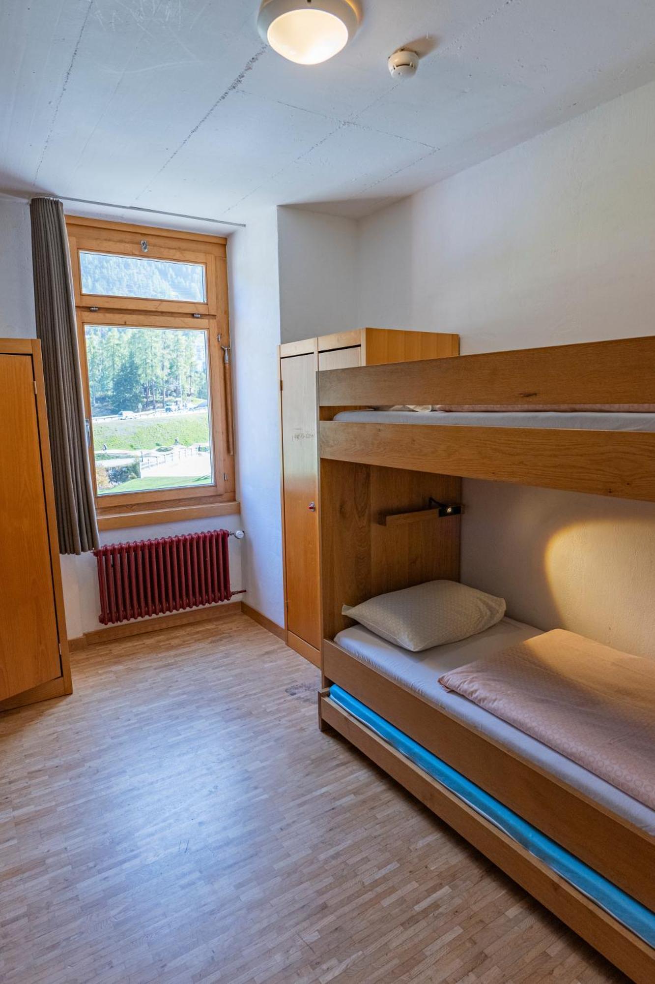 Bett im Männerschlafsaal mit 4 Betten und Gemeinschaftsbad